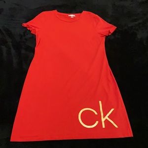 Calvin Klein red T-shirt dress with CK decal on bottom